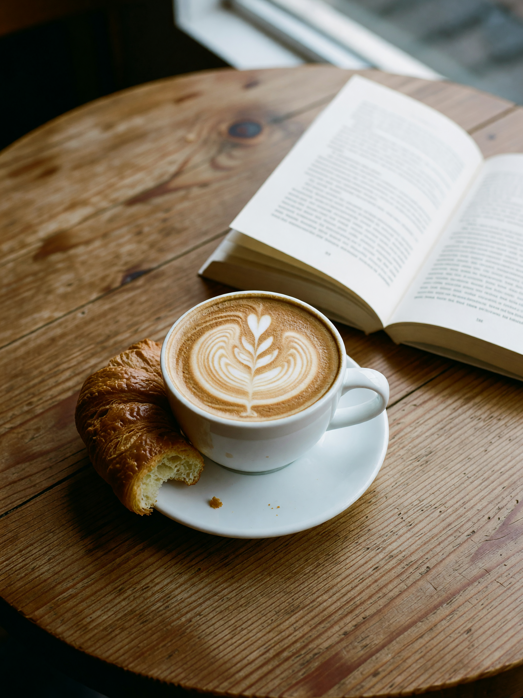 window seat, fresh latte art, and a quiet hour with my notebook. treating myself